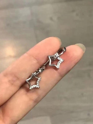 Boucle d'oreille créole en strass étoile creuse