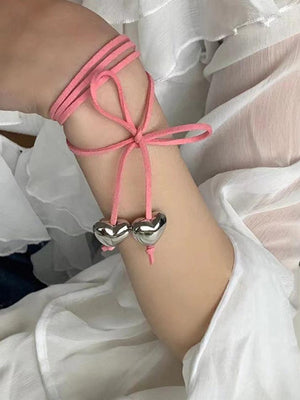 Collier à breloques cœur avec nœud à lacets