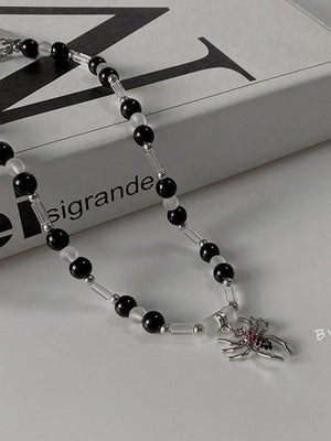 Collier de perles pendentif araignée