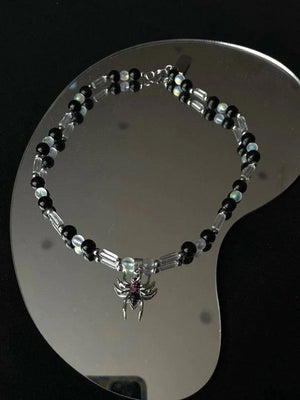 Collier de perles pendentif araignée