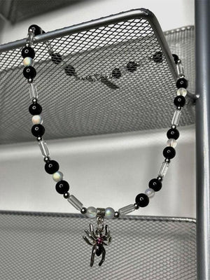 Collier de perles pendentif araignée