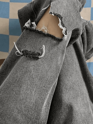 Jean déchiré effiloché délavé vintage