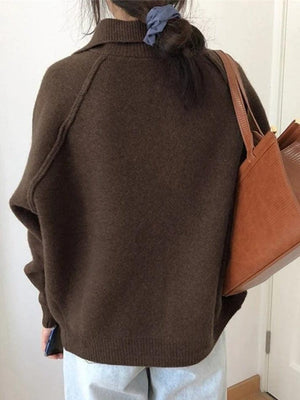 Pull en maille vintage boutonné sur le devant