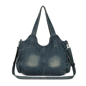Dos du Sac Denim Y2K Vintage en jean bleu foncé avec effet usé. Bandoulière longue pour un porté croisé ou épaule.