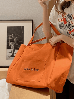 Sac fourre-tout à poche à motif de lettres