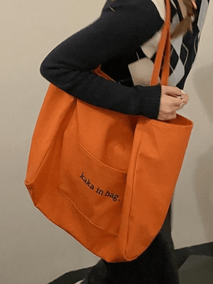 Sac fourre-tout à poche à motif de lettres