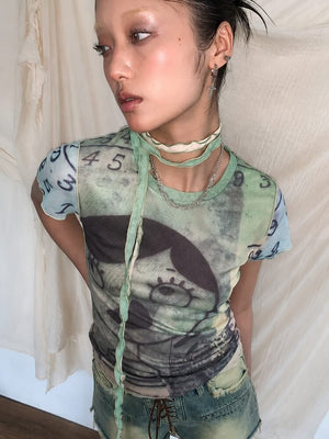 Weirdcore Graphic Baby Tee with sheer mesh, Y2K baby tee styled with low rise bottoms