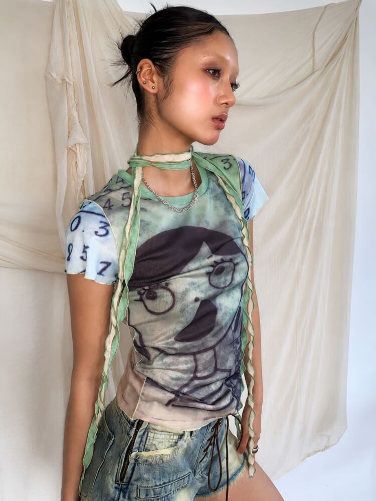 Weirdcore Graphic Baby Tee with sheer mesh, Y2K baby tee styled with low rise bottoms