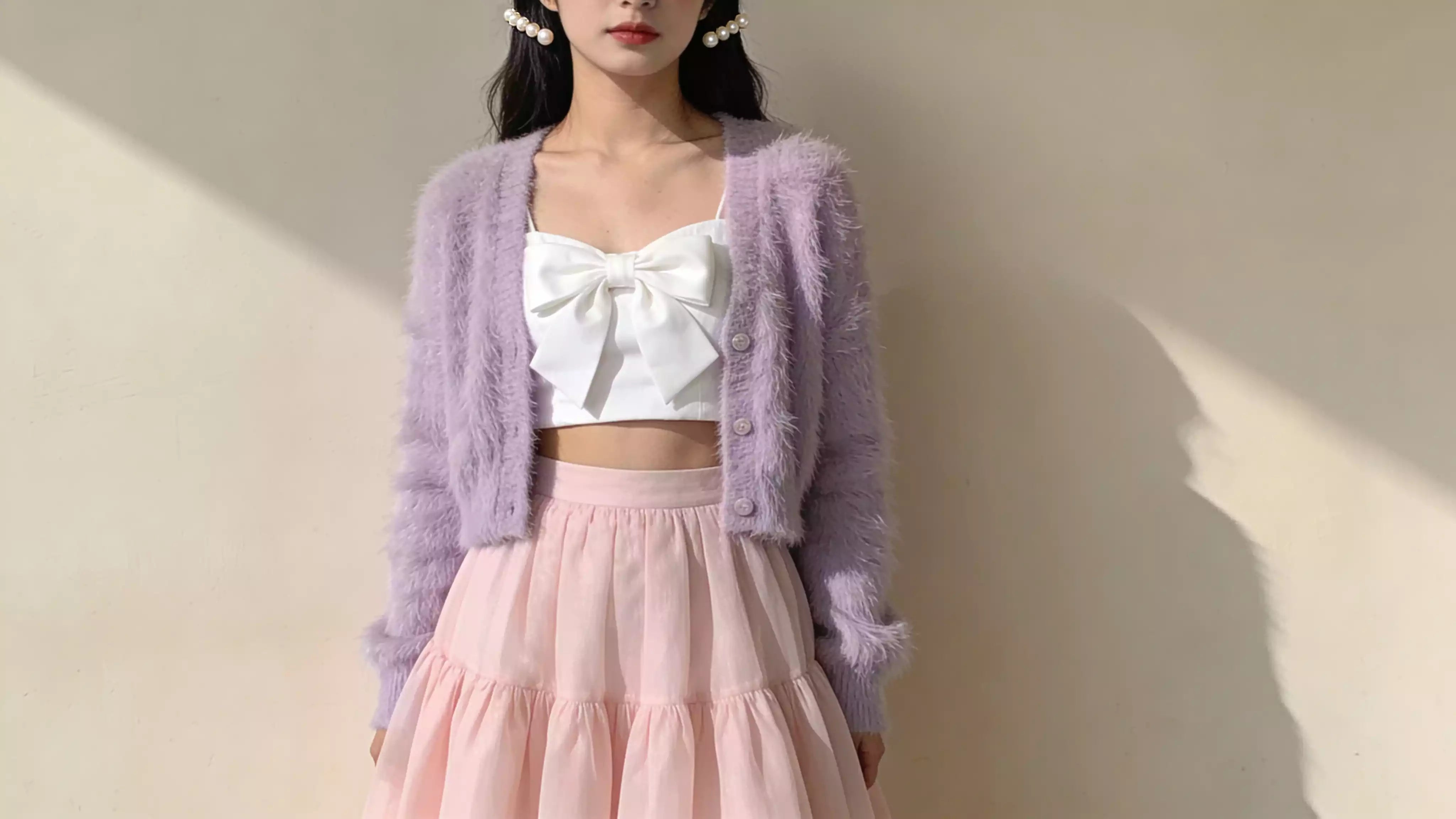 soft girl aesthetic outfit with pastel cardigan and pink skirt