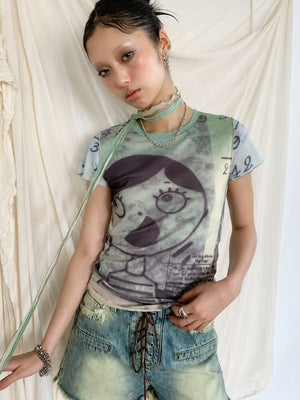 Weirdcore Graphic Baby Tee with sheer mesh, Y2K baby tee styled with low rise bottoms