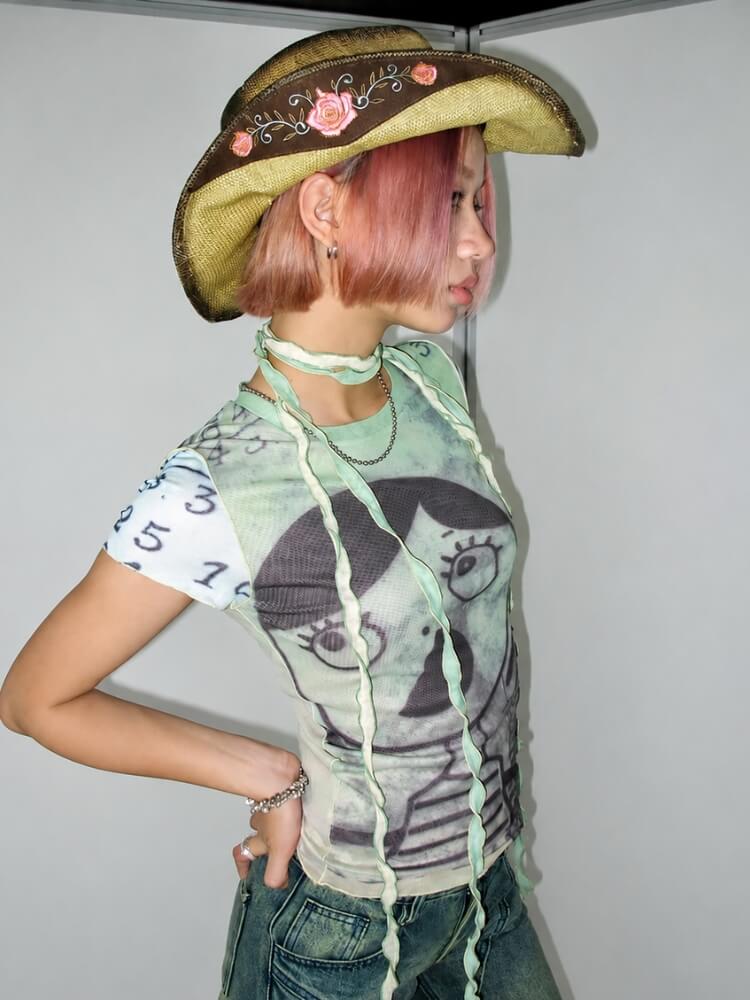 Weirdcore Graphic Baby Tee with sheer mesh, Y2K baby tee styled with low rise bottoms